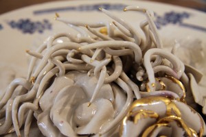 detail of relief decoration with white glaze and gold lustre, chrysanthamums, roses, leaves